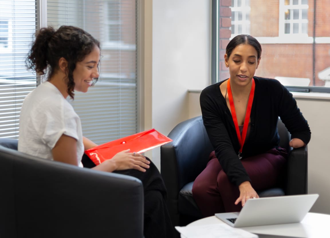 HR Manager talking with Employee in an office