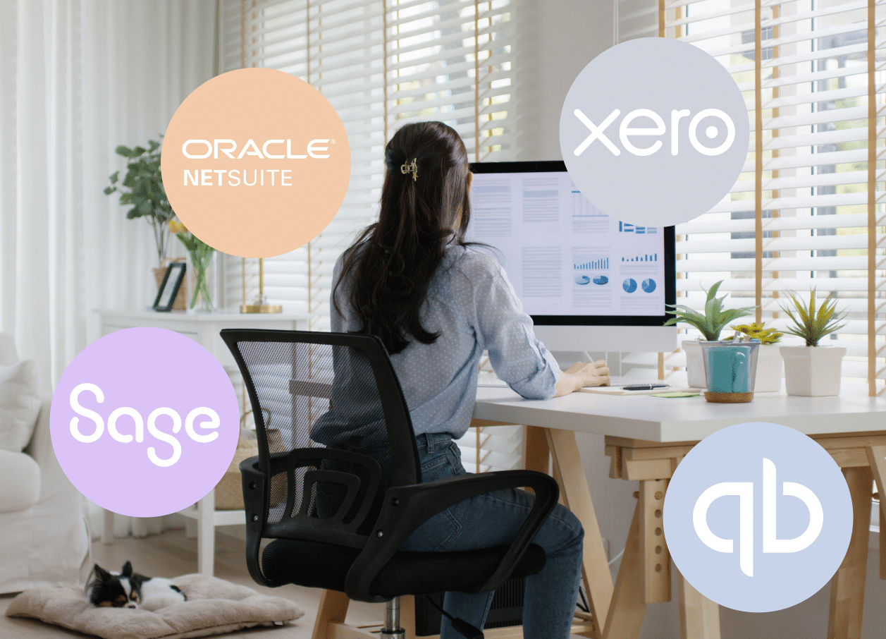 Woman working at desktop computer at home, surrounded by finance software logos